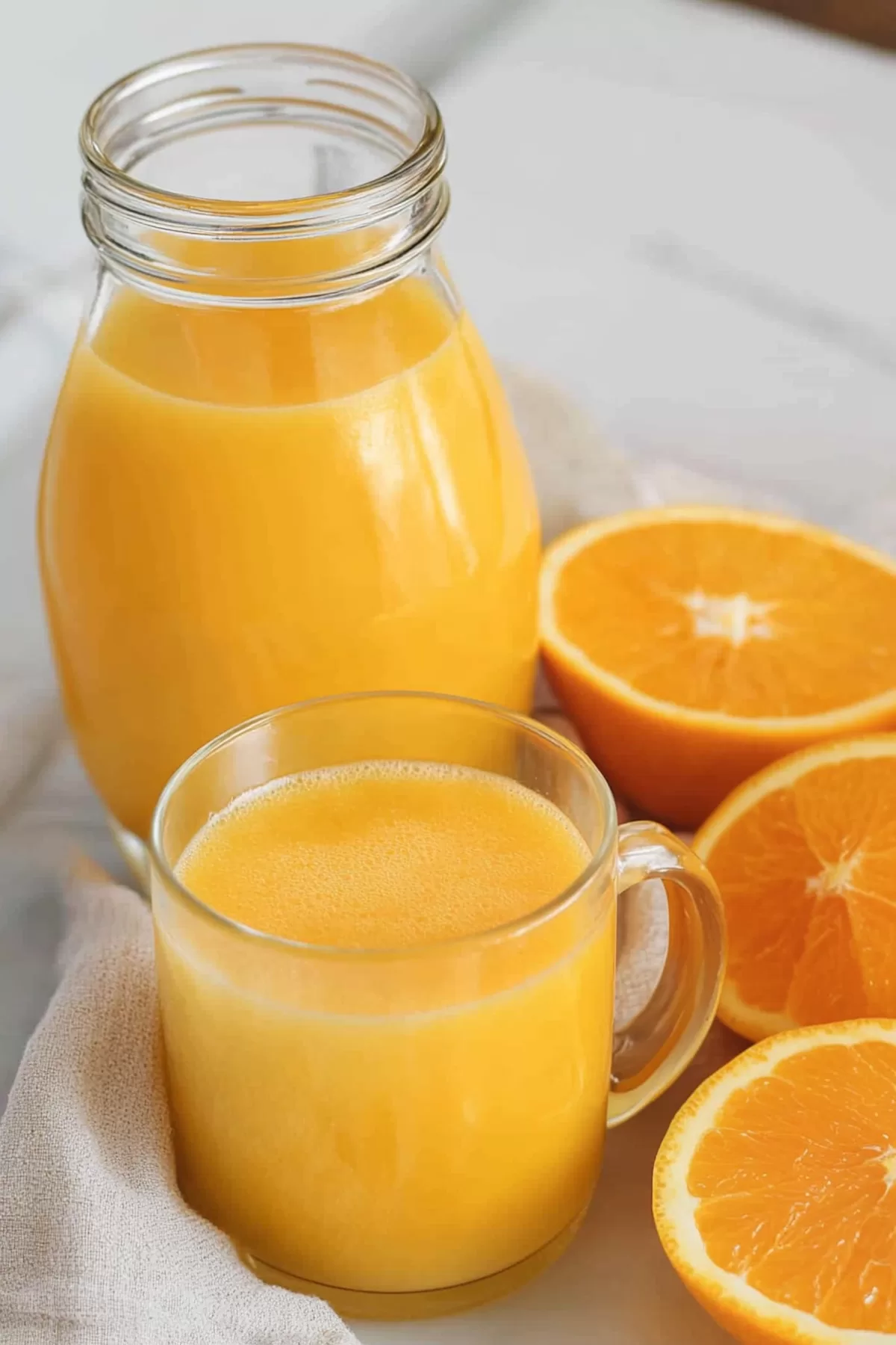 Creamy orange drink in a jar, garnished with an orange slice for a burst of color.