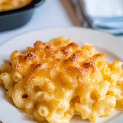 A comforting dish of cheesy macaroni with a golden-brown finish.