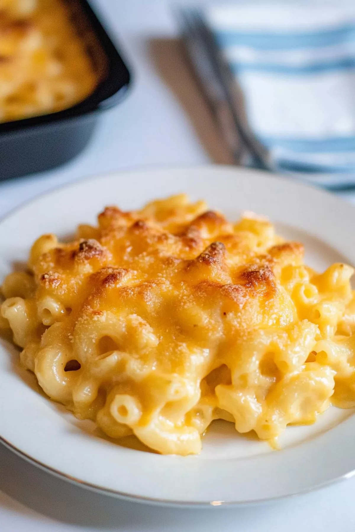 A comforting dish of cheesy macaroni with a golden-brown finish.