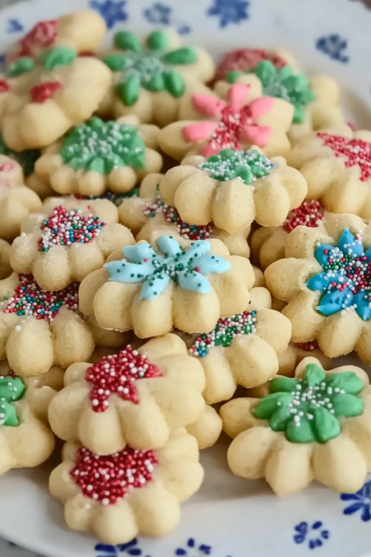 A plate of festive, intricately decorated cookies, perfect for the holiday season.