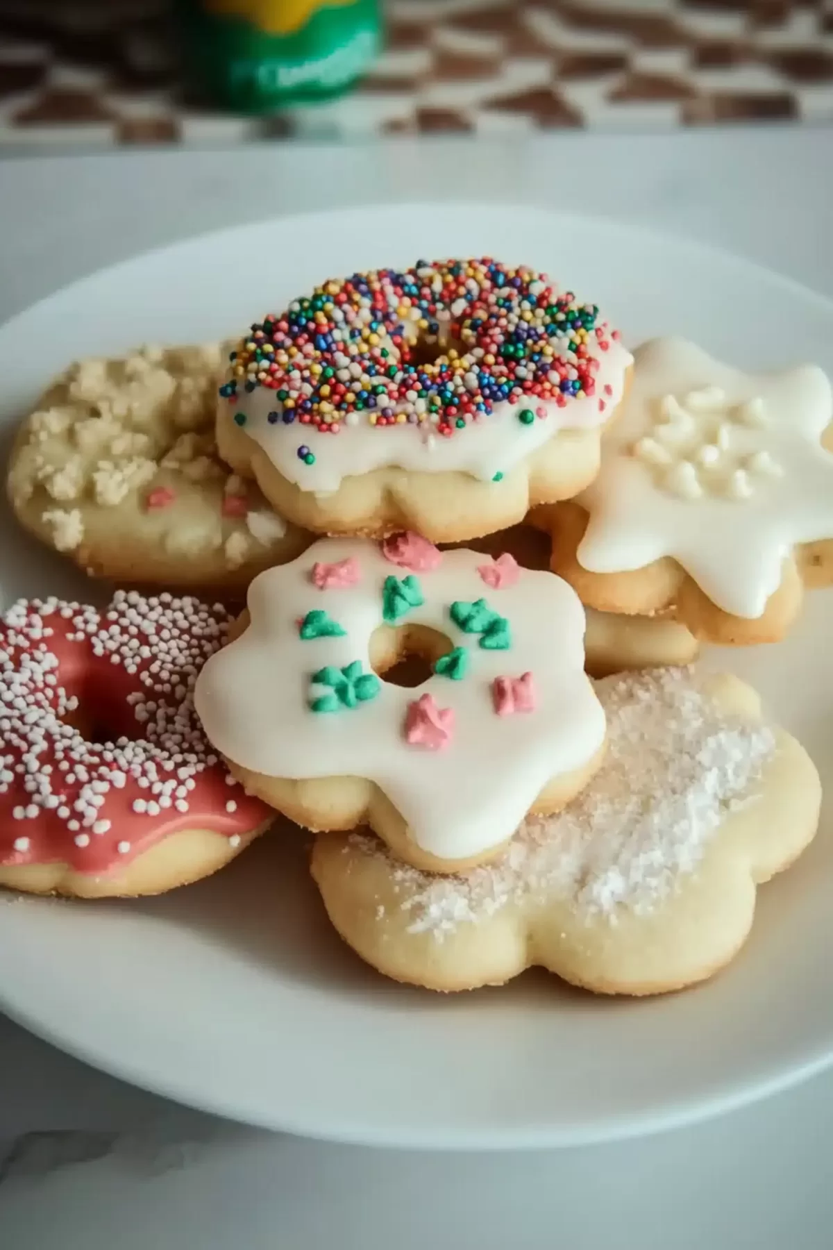 An assortment of buttery cookies with detailed patterns and vibrant decorations.