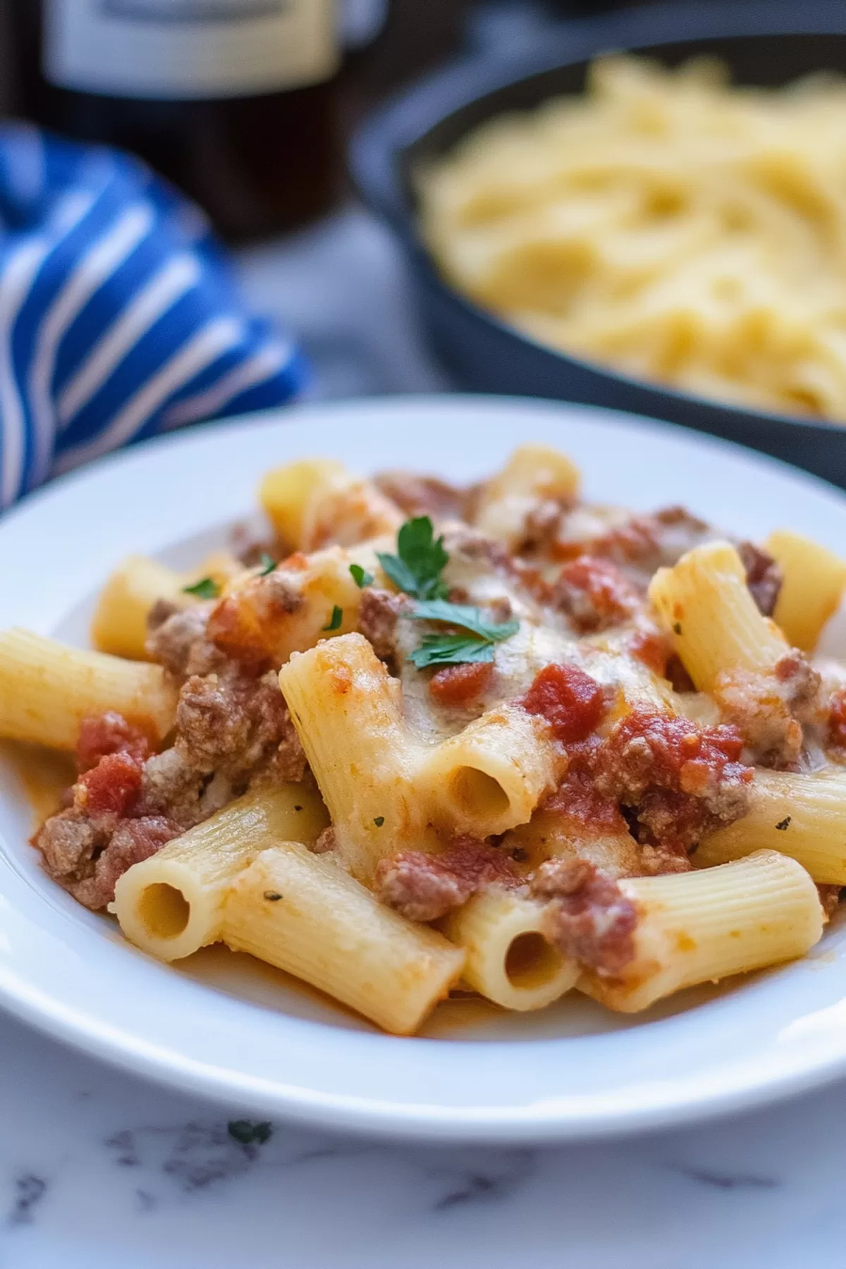 Serving of stuffed pasta on a plate with a garnish of parsley, showcasing the creamy interior.