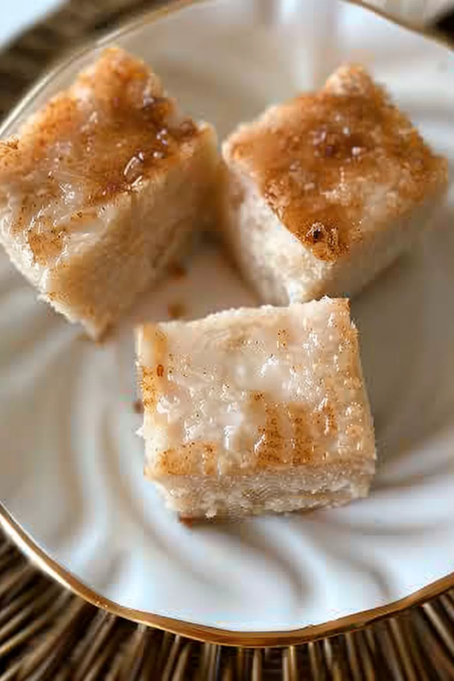 A slice of rich and creamy coconut natilla showing a velvety texture and a hint of spice.