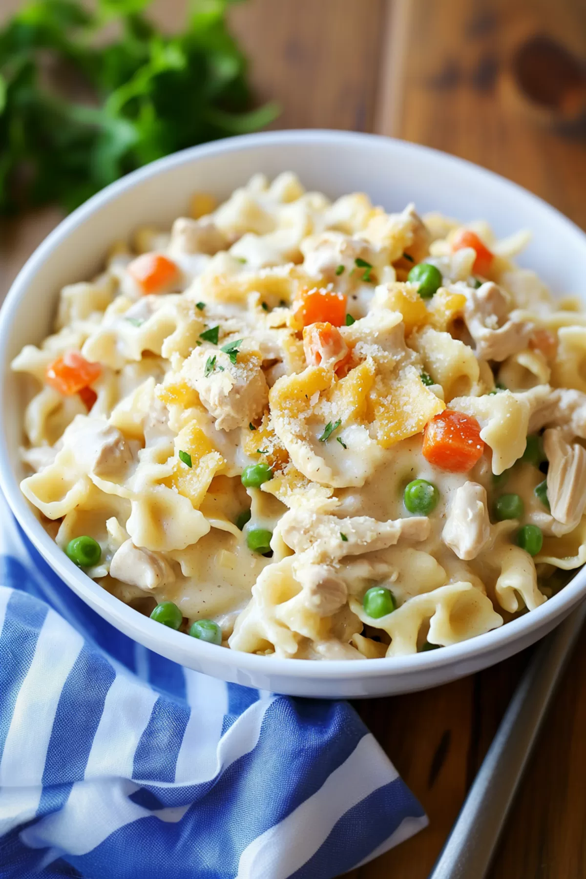 A cozy dish of creamy noodles with a mix of chicken and vegetables, ready to enjoy.