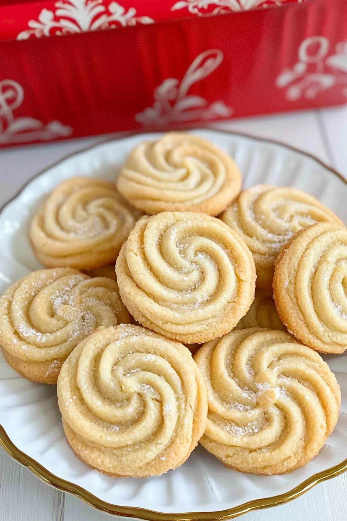 Stacked cookies on a decorative plate, highlighting their intricate swirled patterns.