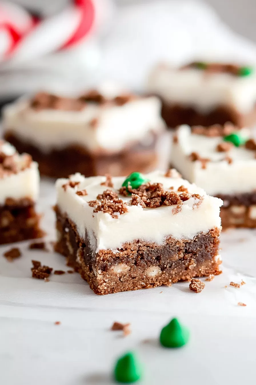 Side view of gingerbread cookie bars, showcasing their soft texture and festive topping.