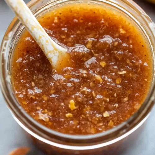 Close-up of a glossy and flavorful dipping sauce, ideal for complementing savory dishes.