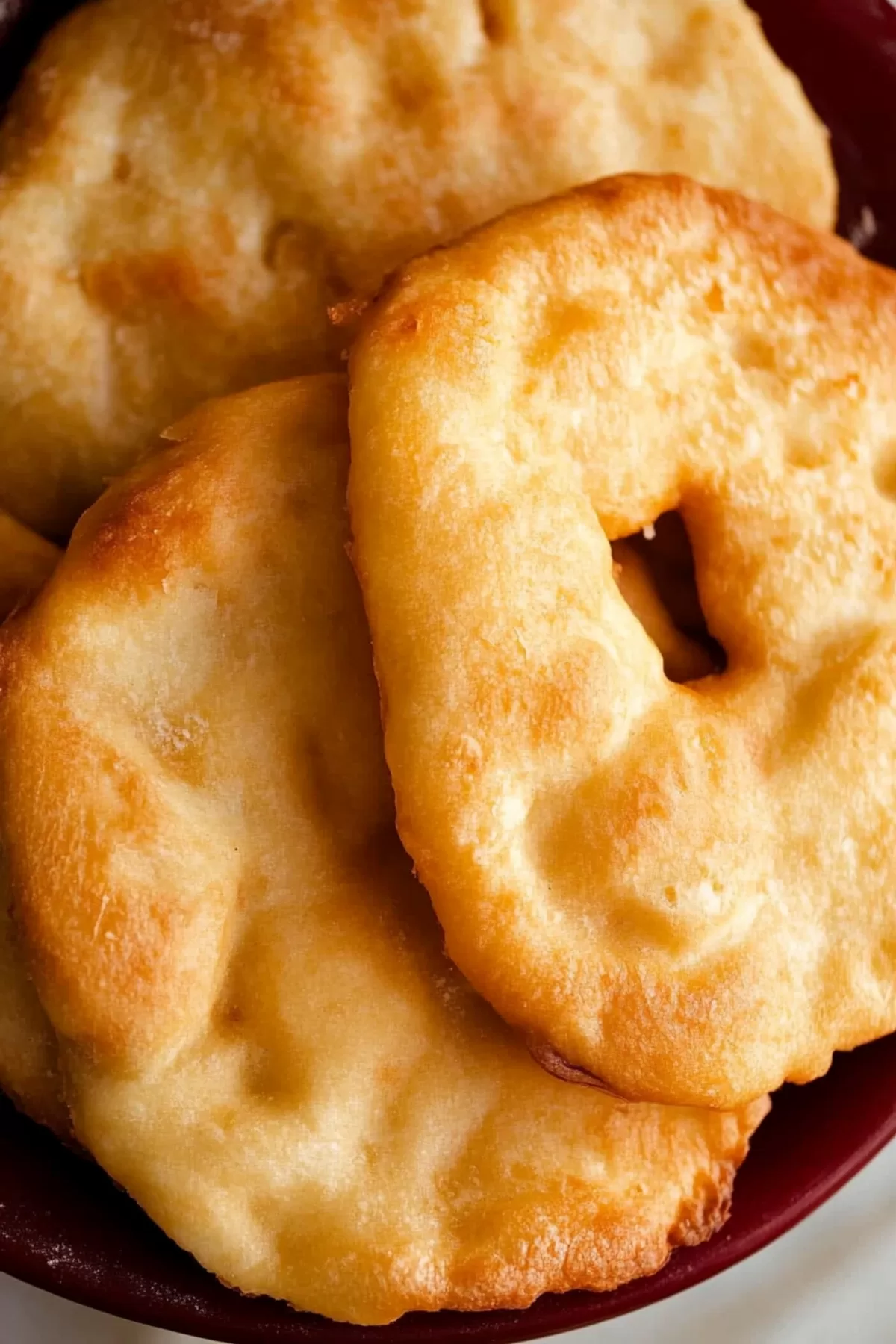 Traditional fry bread showcasing a perfect golden crust and airy middle, ready to serve.