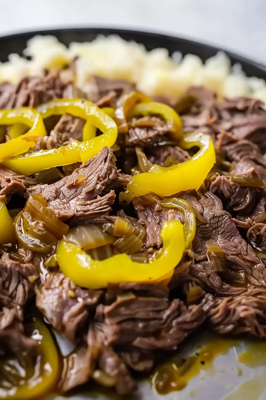 Slow-cooked pot roast with pulled beef and tangy pepperoncini, finished with a rich brown sauce.