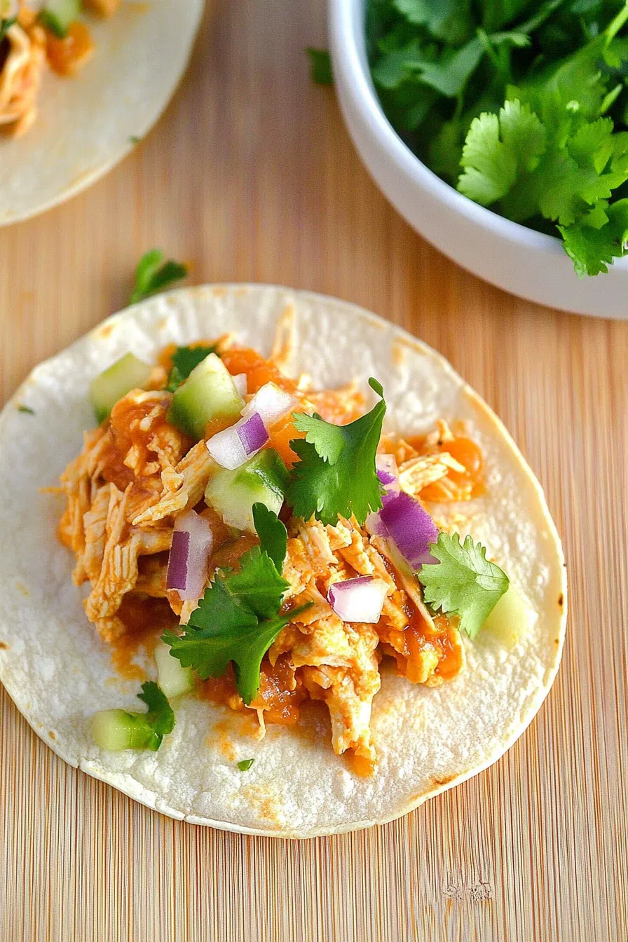 A beautifully arranged plate of jicama tortillas, filled with fresh vegetables and vibrant toppings.