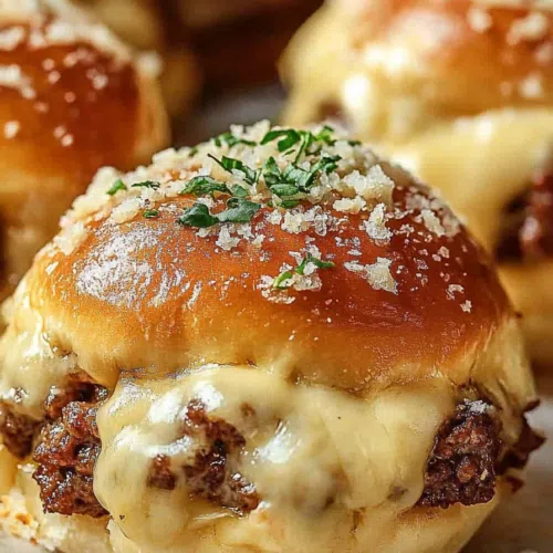 Golden, crispy dough ball cut open to reveal melted cheese and bacon filling.