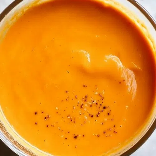 Swirls of sauce on a plate, highlighting its glossy finish.