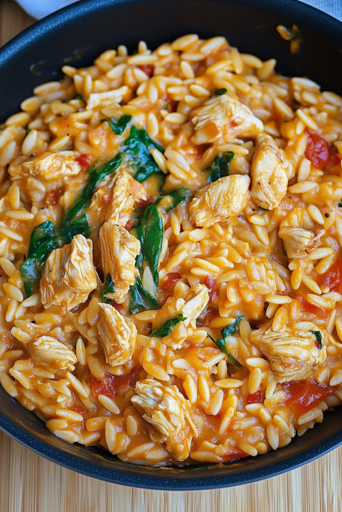 Close-up of a fork lifting a bite of tender chicken with a rich, savory sauce.