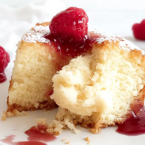 Close-up of a rich cake slice with a caramelized top.