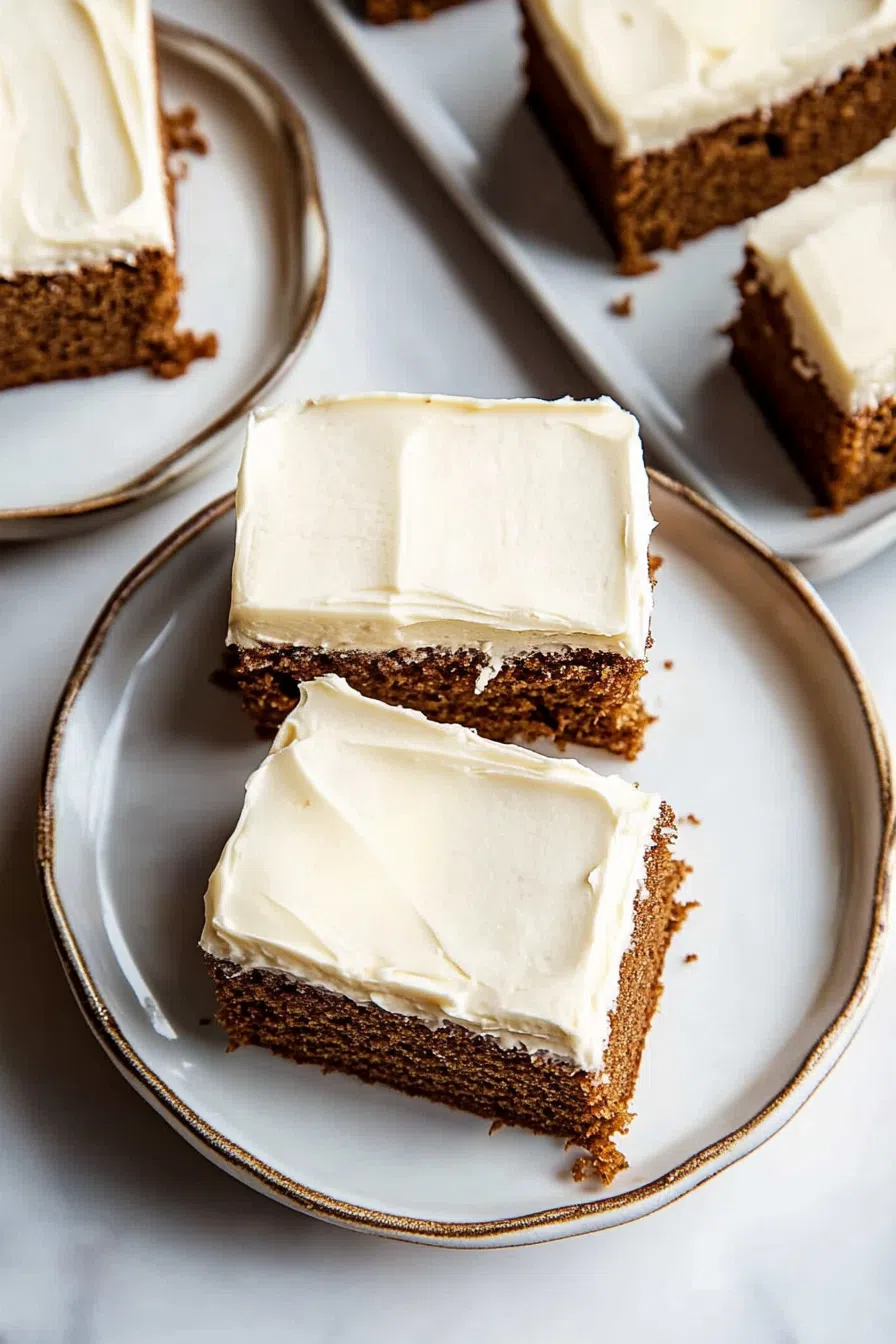 Square slice of cake served on a festive dessert plate.