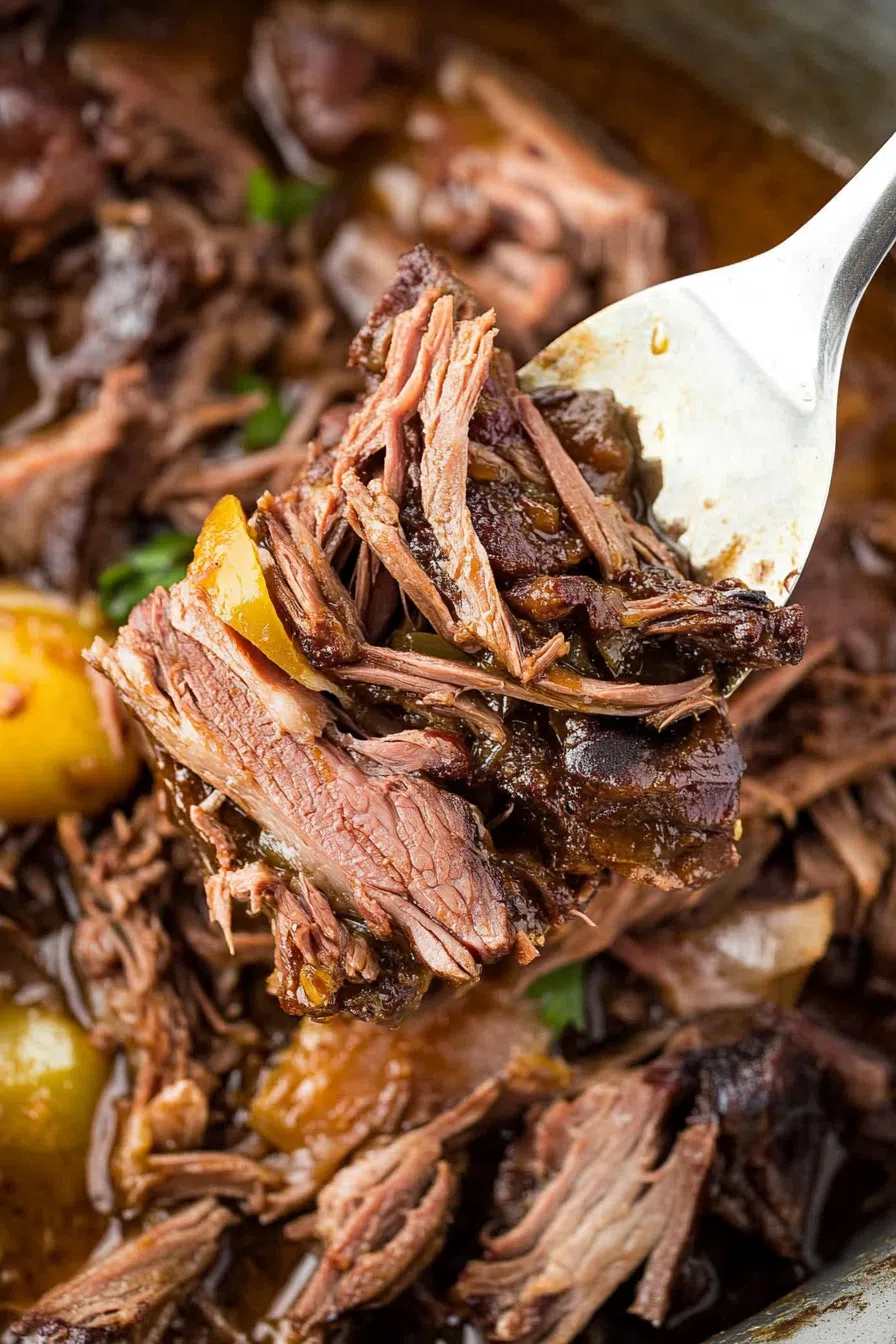 Tender shredded beef served with rich juices and peppers.