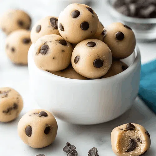 A close-up of bite-sized treats piled high on a serving plate.