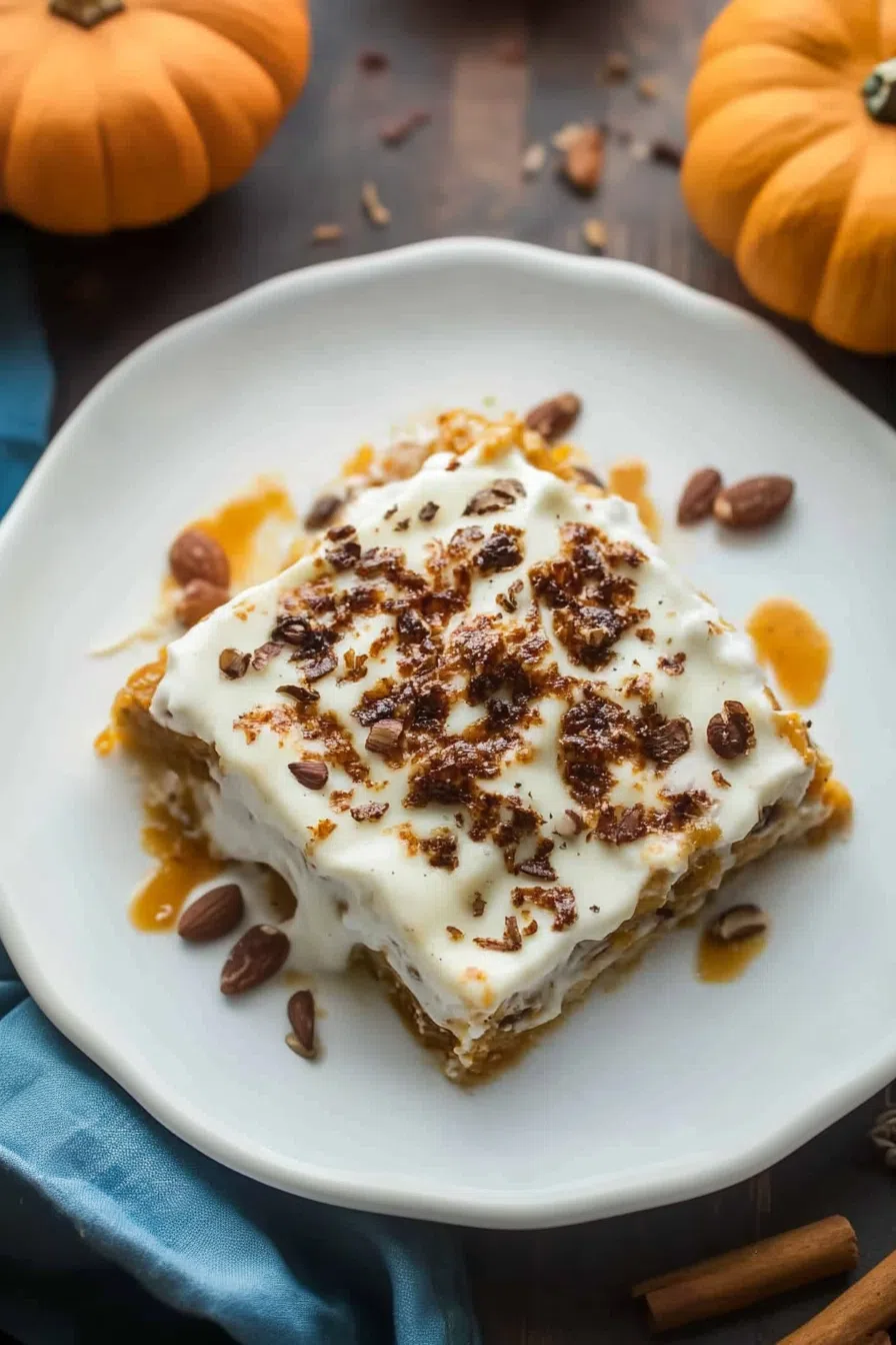 Dessert portion placed on a neutral plate with a drizzle of caramel sauce.