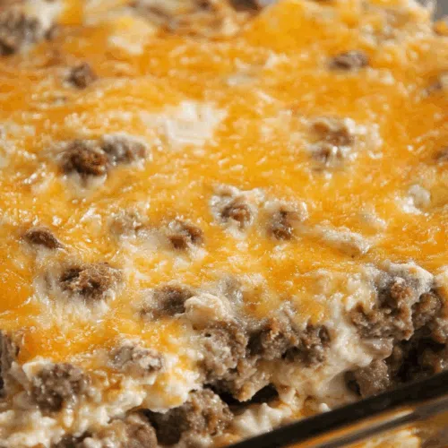 Close-up of a hearty baked dish featuring layers of fluffy texture and savory bits.