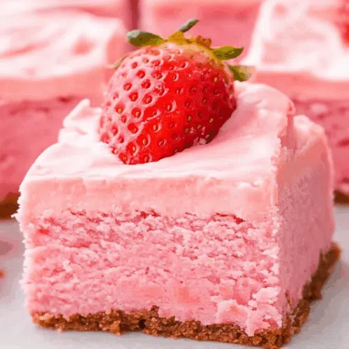 Close-up of a chewy bar treat with glossy glaze on top.