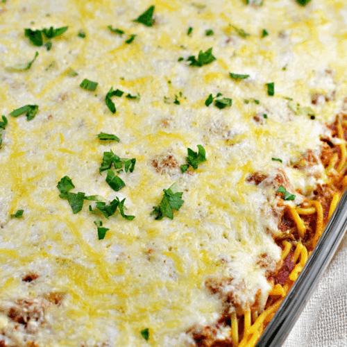 Cheesy pasta dish fresh out of the oven, with a golden, bubbling top.
