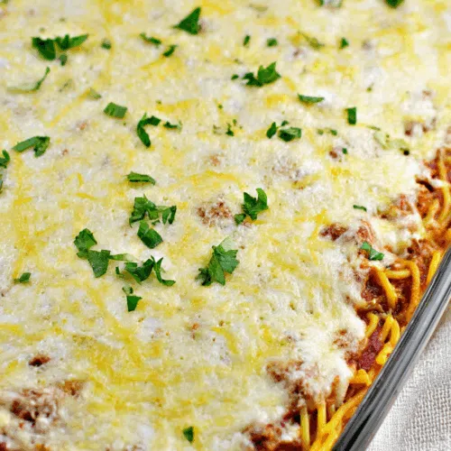 Cheesy pasta dish fresh out of the oven, with a golden, bubbling top.