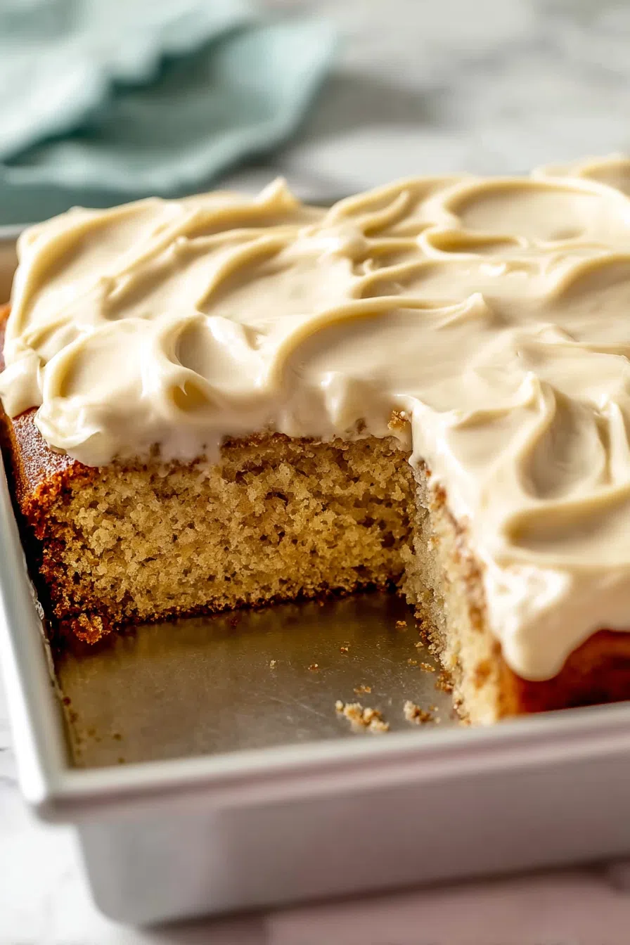 Close-up of the cake’s fluffy interior and smooth icing layer.