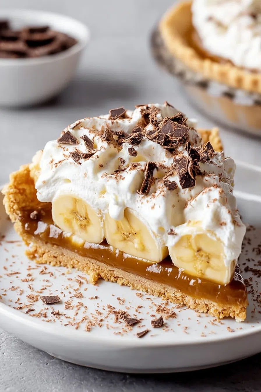 Individual portion of a rich, no-bake treat presented with a fresh banana garnish.