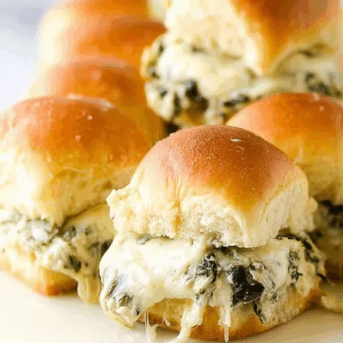 Side view showing toasted tops and creamy layers between soft bread.