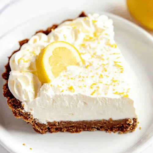 Close-up of a cut slice revealing a creamy yellow filling and graham base.