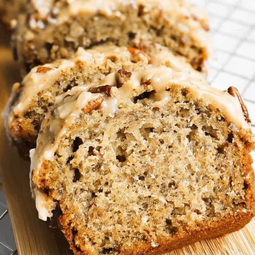 Close-up of a moist, textured slice topped with a light glaze.