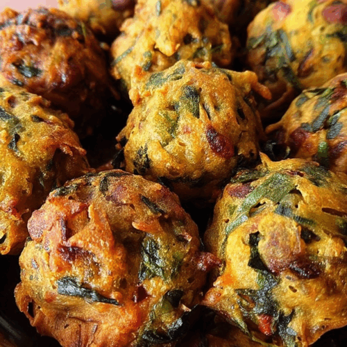 Close-up of a crispy snack broken open to reveal a vibrant green center.