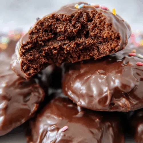 Close-up of glossy baked treats with a fudgy glaze.