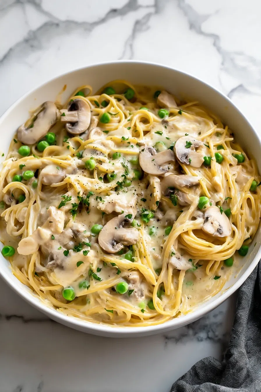 Baked comfort food dish with herbs and a golden topping, ready to serve.