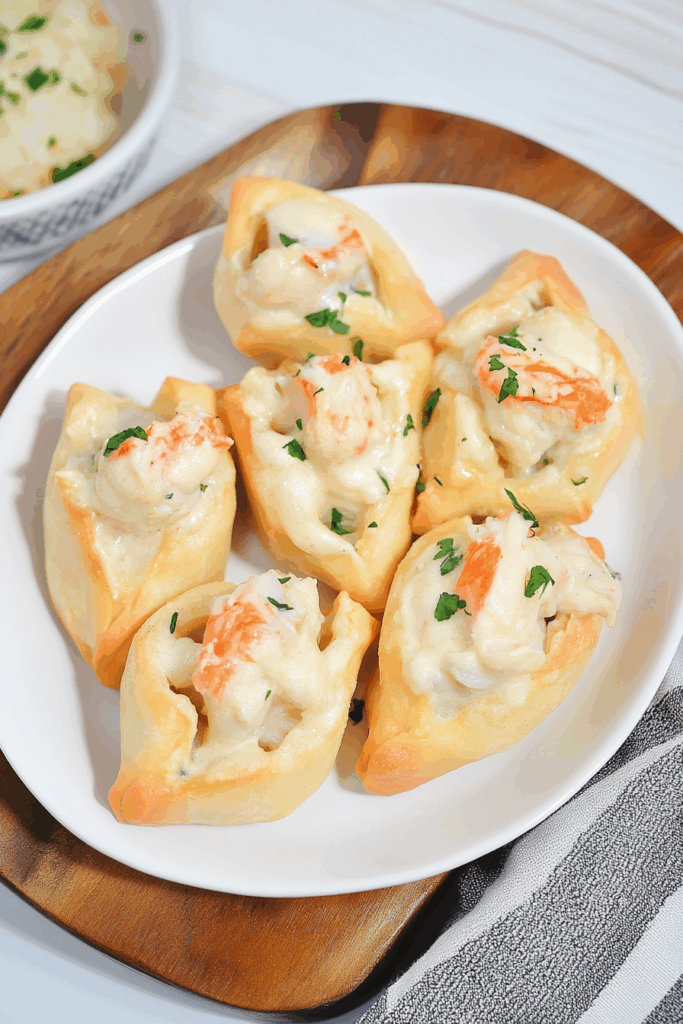 Overhead view of savory canapés with a slightly golden finish and melted topping.