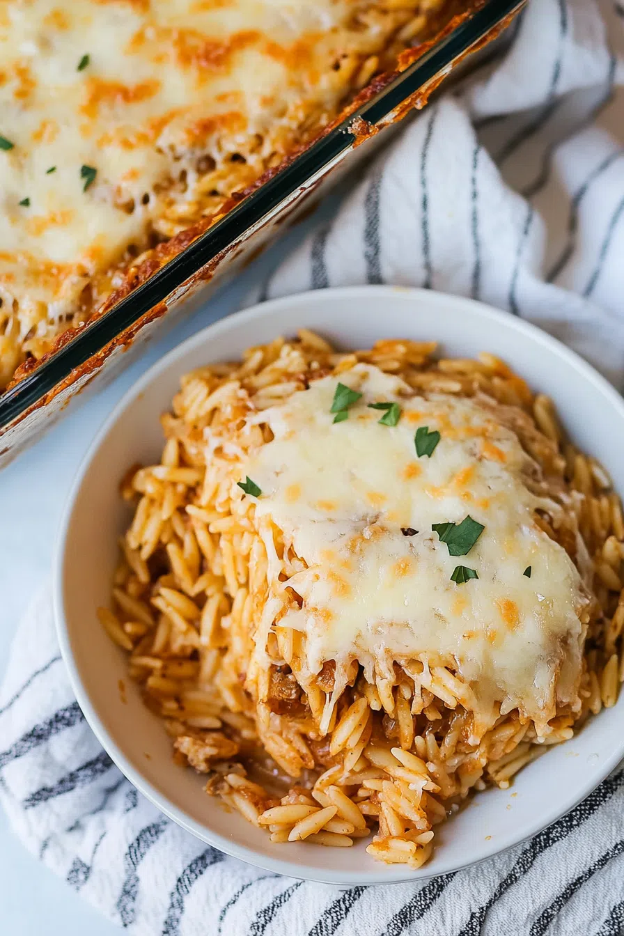 Individual serving plated with crispy edges and gooey center on a neutral dish.