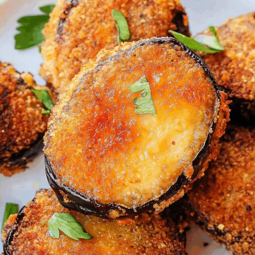 Close-up of breaded vegetable rounds with a crunchy coating and soft interior.