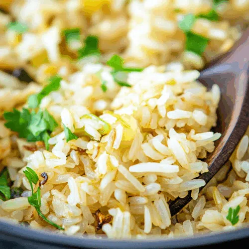 Fluffy, seasoned rice mixed with fresh herbs and diced vegetables.