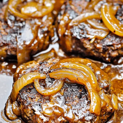 Close-up of caramelized onions layered over pan-seared meat.