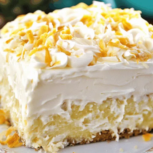 A light and fluffy cake slice topped with creamy frosting and crushed pineapple.