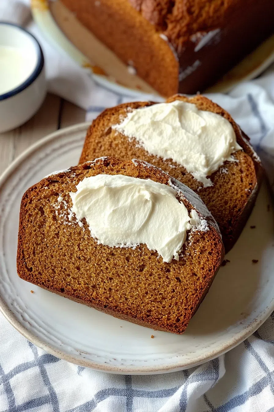 Thick slices of homemade bread arranged on a neutral-toned plate.