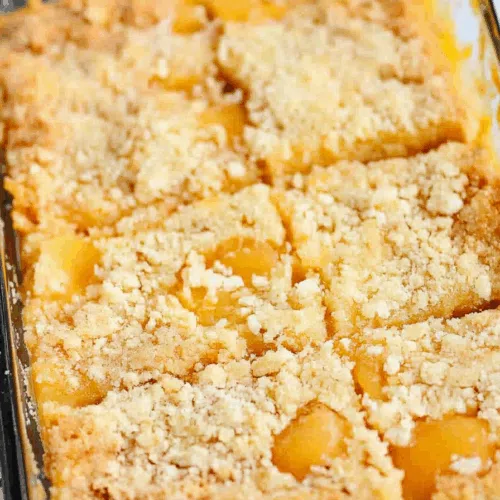 Top-down shot of freshly baked bars in a pan, ready to be served.