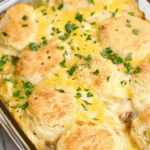 Comfort food breakfast bake with a golden crust and rich sausage gravy throughout.