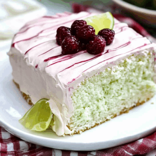 Close-up of a glossy topping on a moist, citrus-colored cake.