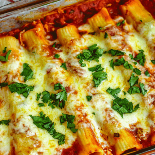 Overhead view of stuffed pasta in a bubbling cheese-topped dish