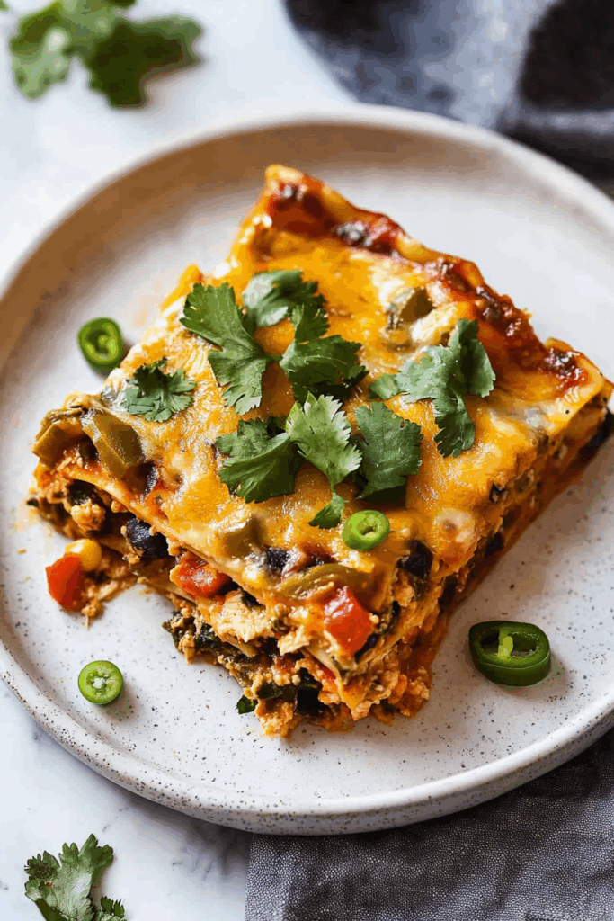 Baked casserole dish with rich, bubbly edges and Mexican-style seasonings