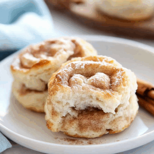 Soft, layered pastries served with a small dish of honey butter