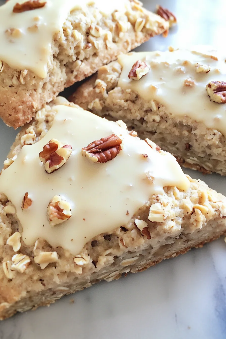 Close-up of crumbly, nut-studded baked treats arranged on a plate.