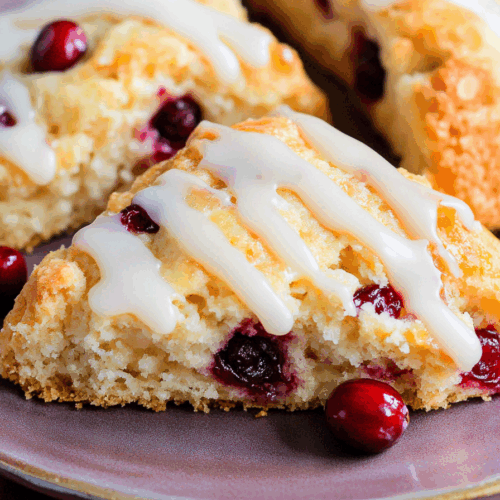 Close-up of golden baked goods with a sweet drizzle and pink specks