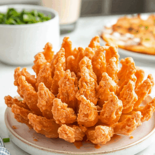 Crispy, golden-fried appetizer with a layered, petal-like presentation